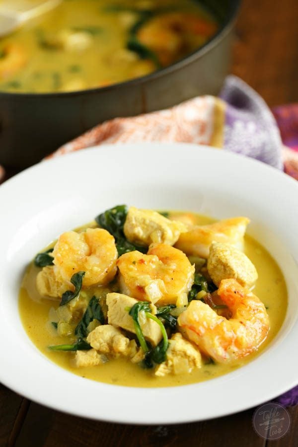 This garlic coconut curry shrimp bowl is bursting with rich flavor and paleo-friendly! You'll love the crispy exterior of the shrimp in the creamy and hearty soup!