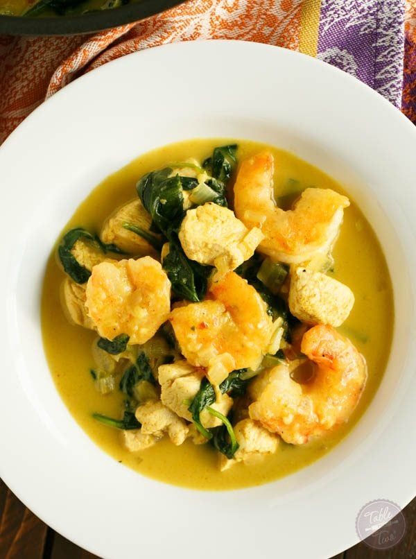This garlic coconut curry shrimp bowl is bursting with rich flavor and paleo-friendly! You'll love the crispy exterior of the shrimp in the creamy and hearty soup!