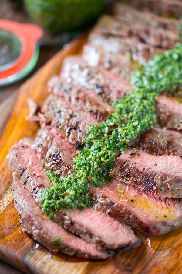 Grilled flank steak with homemade chimichurri sauce is the perfect summertime recipe! Dust off those grills and get your steak on!