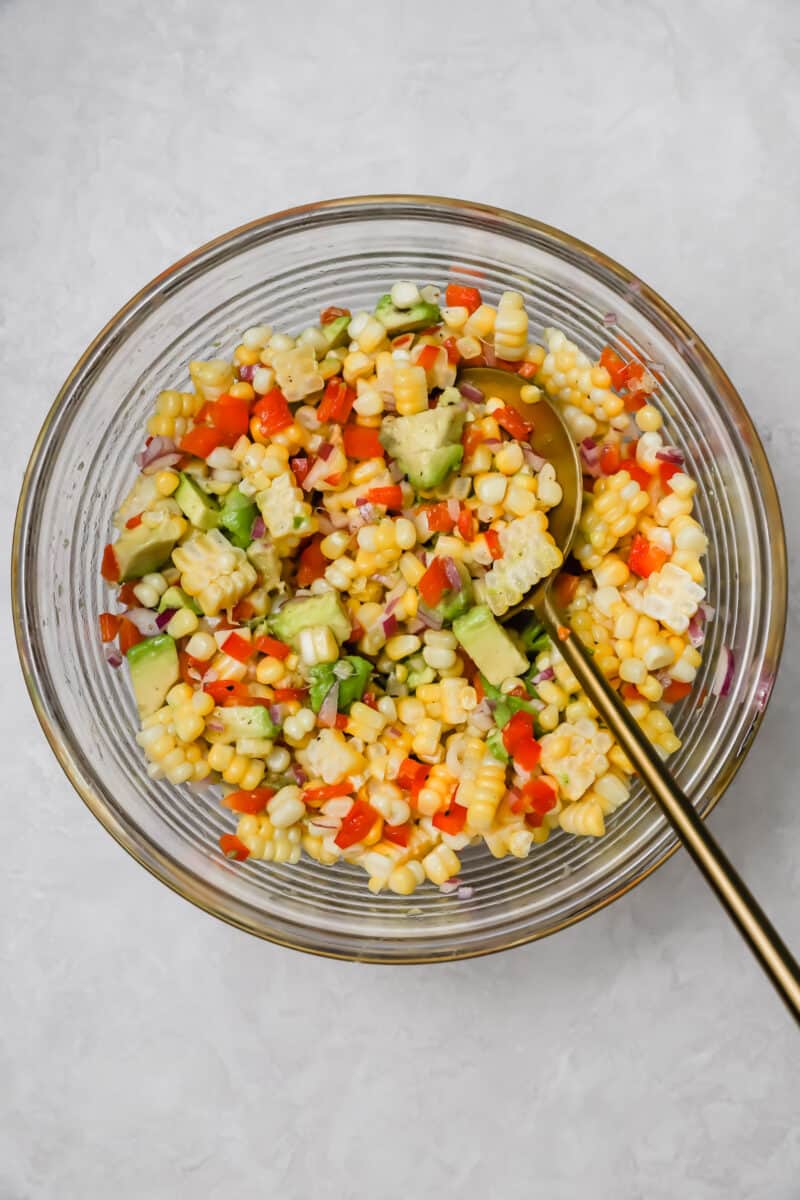 Corn and avocado salsa is an easy side dish to go with any dinner or grilling party! A great way to use up summer's sweetness.