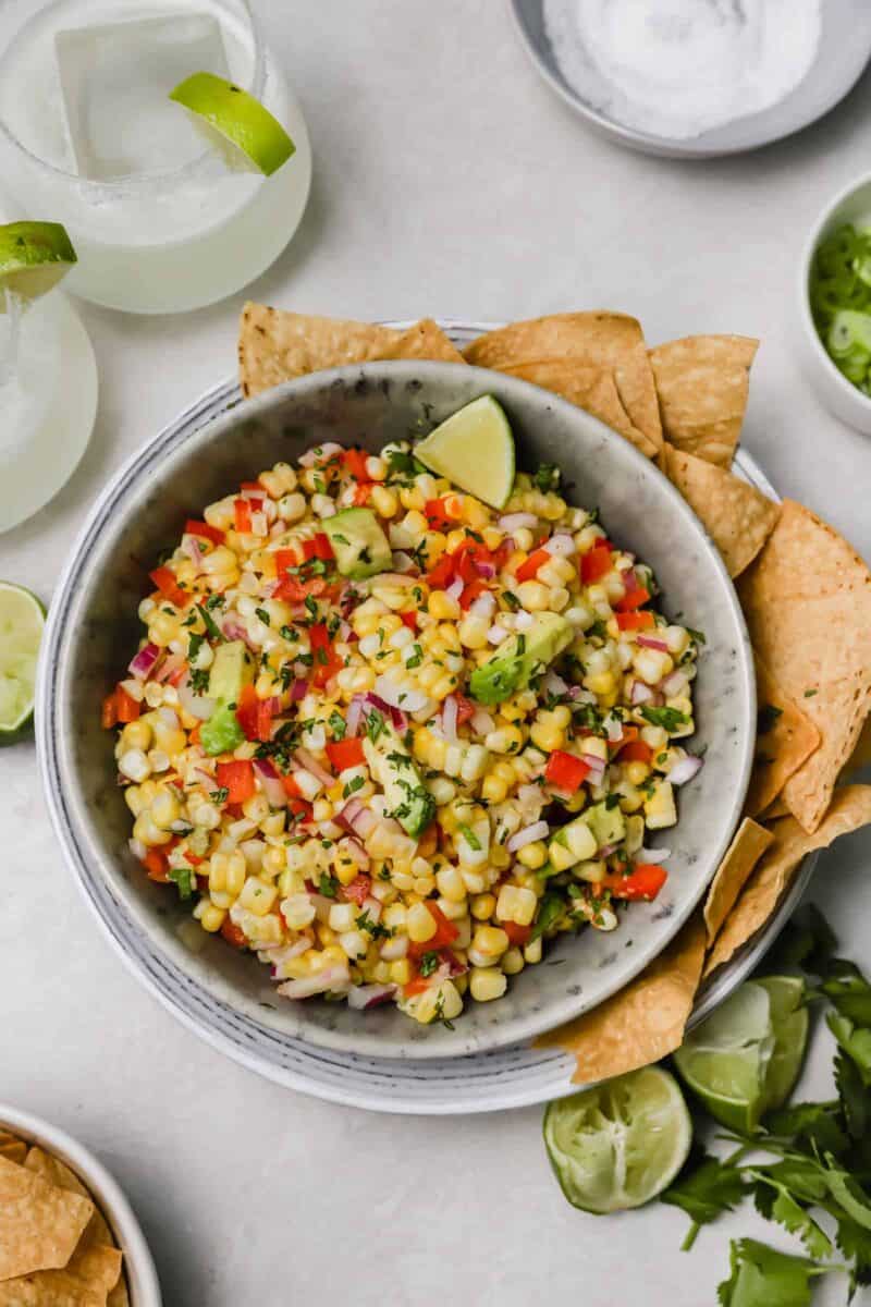Corn and avocado salsa is an easy side dish to go with any dinner or grilling party! A great way to use up summer's sweetness.