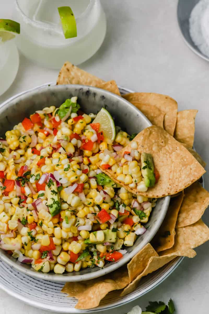 Corn and avocado salsa is an easy side dish to go with any dinner or grilling party! A great way to use up summer's sweetness.