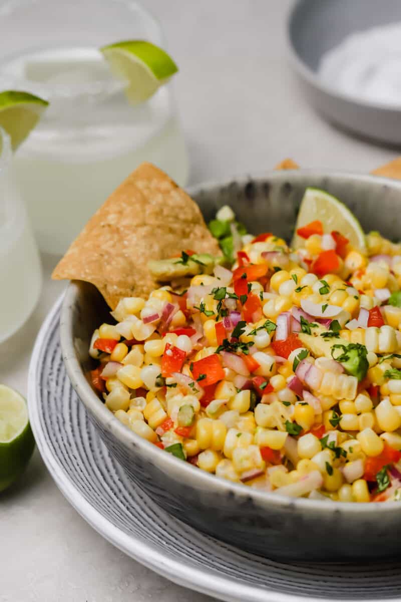 Corn and avocado salsa is an easy side dish to go with any dinner or grilling party! A great way to use up summer's sweetness.