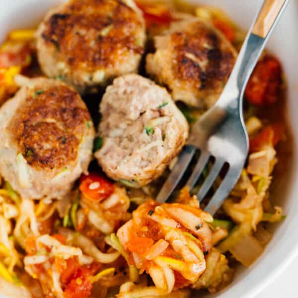 Make a batch of these zucchini turkey meatballs with zoodles. Freeze half the meatballs then use them to top over a savory zoodle dish later! Paleo-friendly!