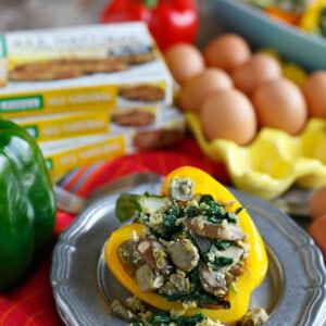 Stuffed breakfast peppers filled with sausage, spinach, mushrooms, and eggs are a fun new way to serve breakfast and eat it too! #sponsored