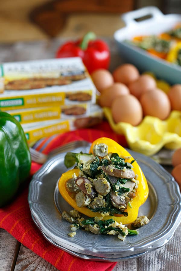 Stuffed breakfast peppers filled with sausage, spinach, mushrooms, and eggs are a fun new way to serve breakfast and eat it too!