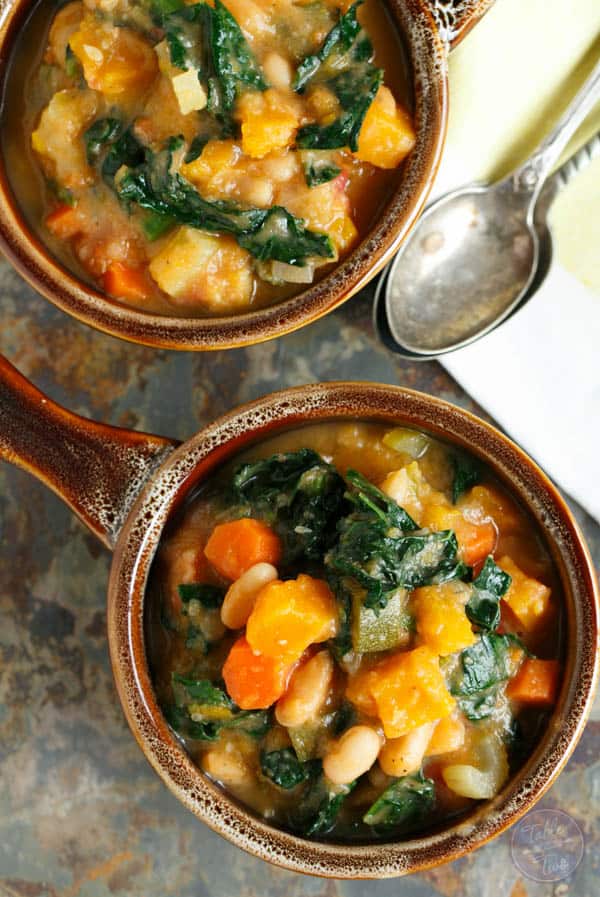 Warm up for game time with this dairy-free and meatless butternut squash white bean kale stew! This recipe is full of hearty veggies! Can we say touchdown?! #MeatlessMondayNight #ad #dairyfree