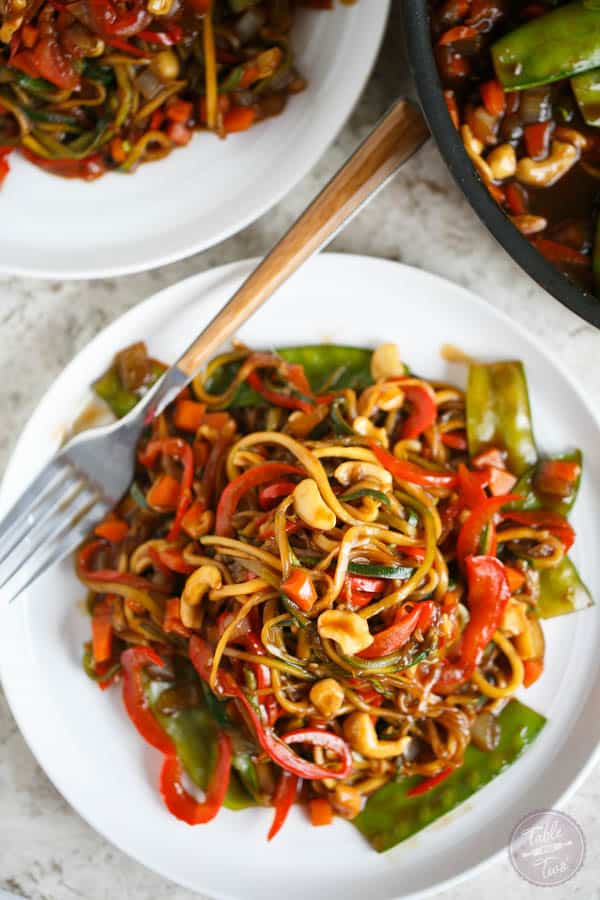 This easy zucchini noodle cashew stir fry made with The Inspiralizer will have you licking your plate clean! Dinner comes together in less than 30 minutes and you'll want to put this sauce on every meal! #inspiralizer