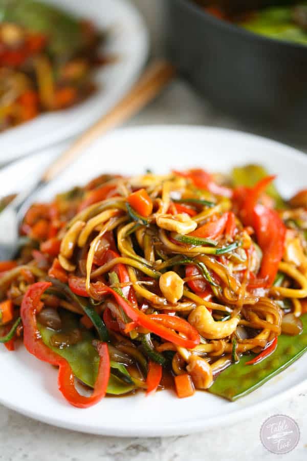 This easy zucchini noodle cashew stir fry made with The Inspiralizer will have you licking your plate clean! Dinner comes together in less than 30 minutes and you'll want to put this sauce on every meal! #inspiralizer