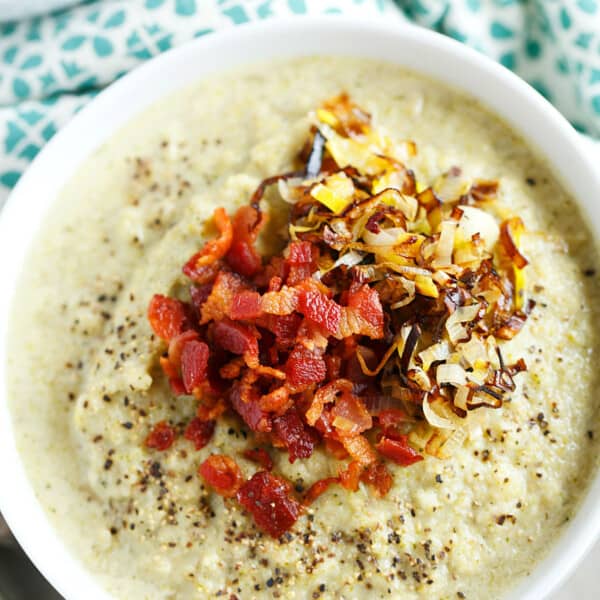 This simple roasted broccoli and cauliflower soup with crispy leeks and bacon will be your new favorite soup to warm you right up! So much flavor and it could not be simpler to make! #POURLOVEINN with College Inn Chicken Broth! #sponsored