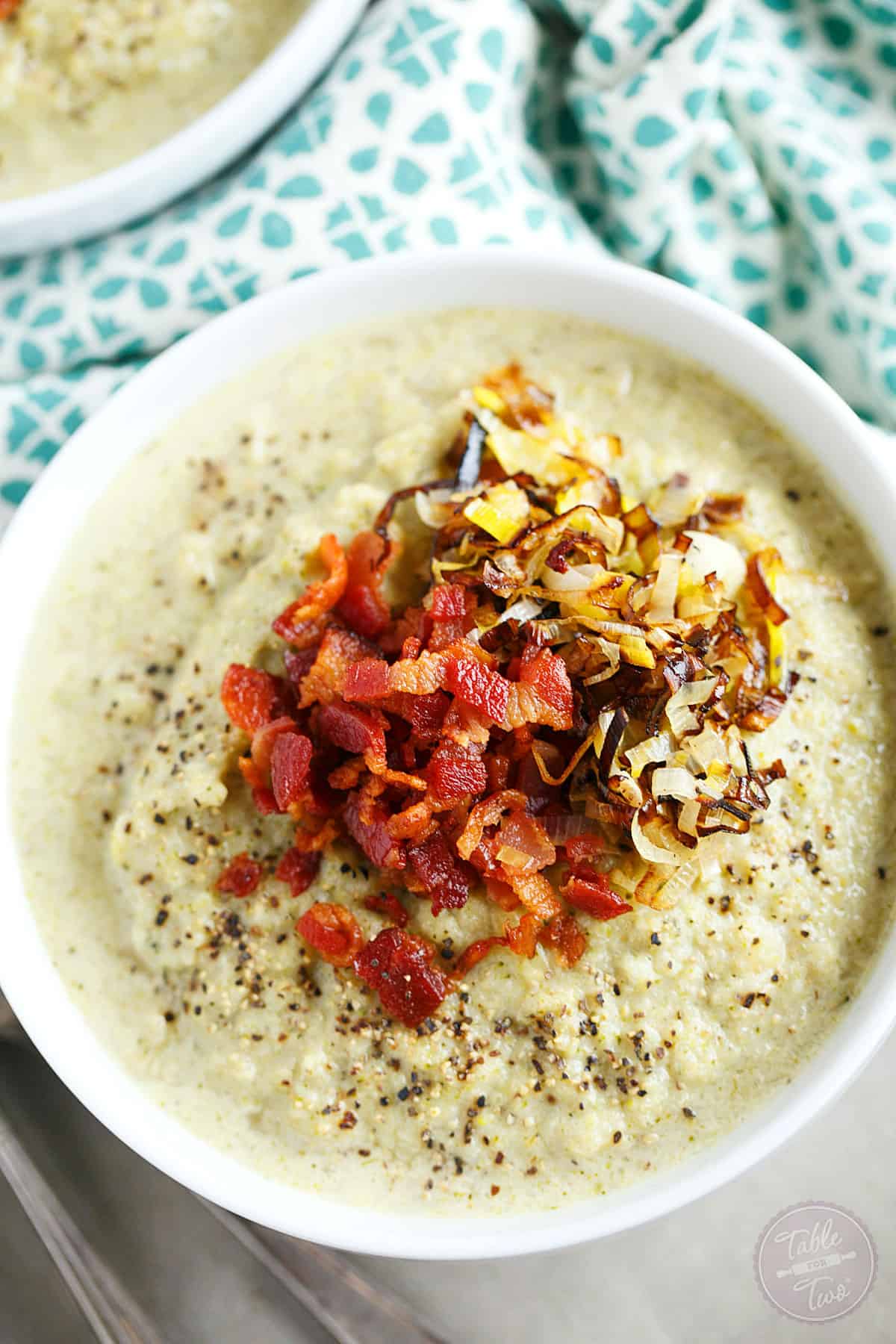 This simple roasted broccoli and cauliflower soup with crispy leeks and bacon will be your new favorite soup to warm you right up! So much flavor and it could not be simpler to make! #POURLOVEINN with College Inn Chicken Broth! #sponsored