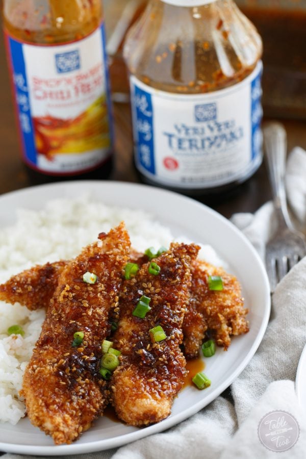 Crispy Sweet and Spicy Chicken Tenders placed on top of rice is delicious way to spice up your weeknight dinner with @soyvay! #teamrice all the way! #UnlocktheAwesome #sponsored