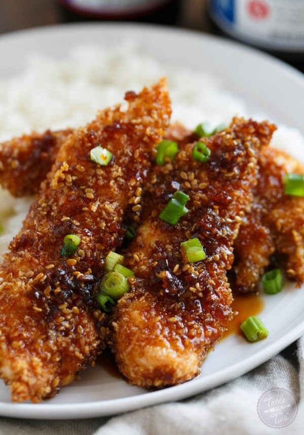 Crispy Sweet and Spicy Chicken Tenders placed on top of rice is delicious way to spice up your weeknight dinner with @soyvay! #teamrice all the way! #UnlocktheAwesome #sponsored