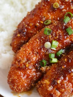 Crispy Sweet and Spicy Chicken Tenders placed on top of rice is delicious way to spice up your weeknight dinner with @soyvay! #teamrice all the way! #UnlocktheAwesome #sponsored