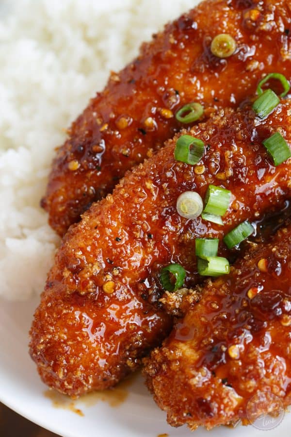 Crispy Sweet and Spicy Chicken Tenders placed on top of rice is delicious way to spice up your weeknight dinner with @soyvay! #teamrice all the way! #UnlocktheAwesome #sponsored
