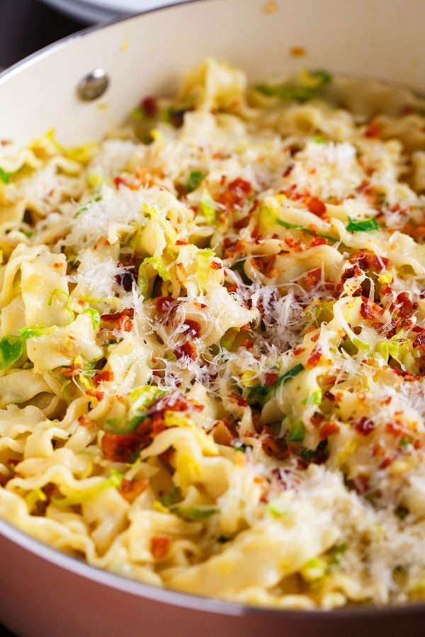 Basic bacon and brussels sprouts pasta carbonara is a take on the classic creamy pasta. It's still got all the flavor but just more ingredients to love!