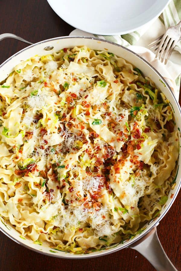 Basic bacon and brussels sprouts pasta carbonara is a take on the classic creamy pasta. It's still got all the flavor but just more ingredients to love!