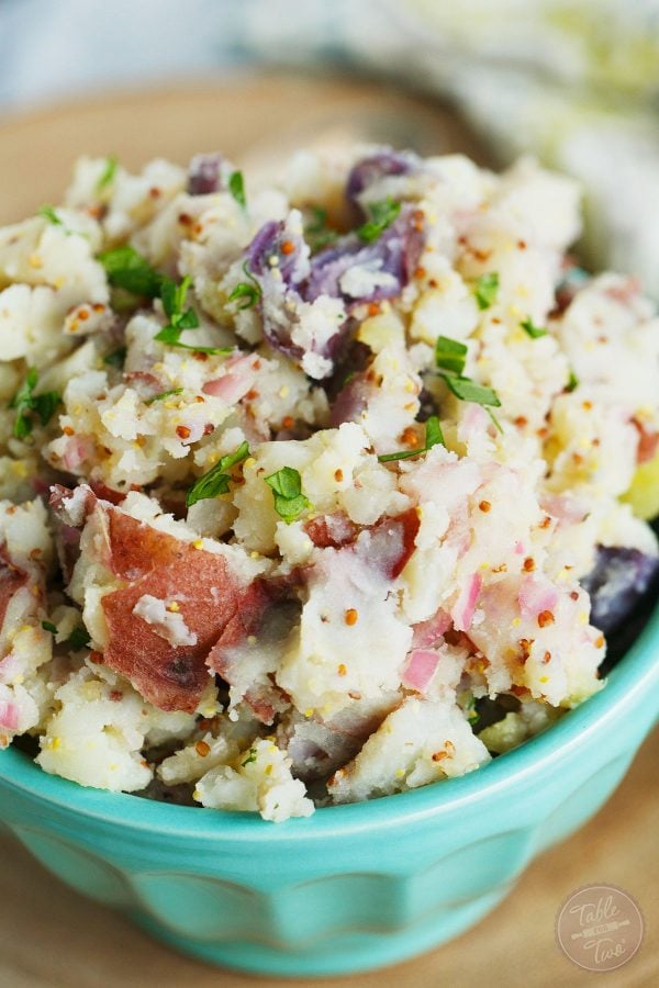 This tangy potato salad is only 4 ingredients and you'll love this new way of eating potato salad. Seriously, give it a chance!