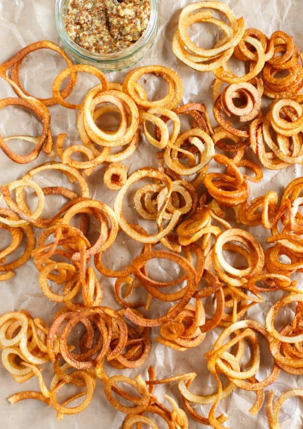 If you are a fan of curly fries and mustard, then this recipe is for you! Homemade curly fries are so versatile and easy to make. You might have a hard time sharing them!