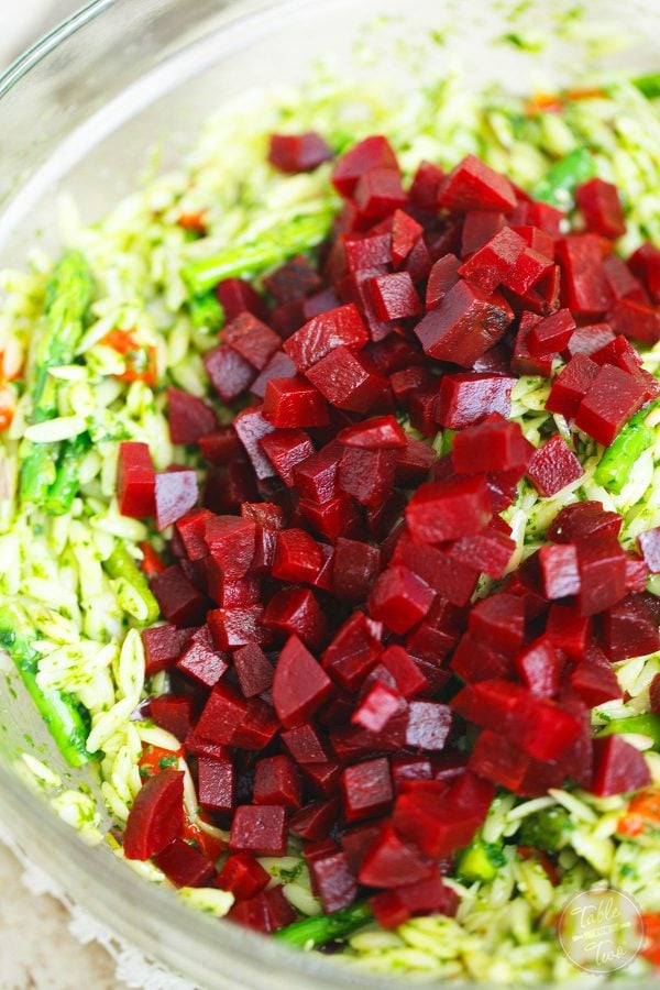 A great springtime pasta salad dish to bring to outdoor events or to have at home! The flavors and colors of this dish will make any day cheery!