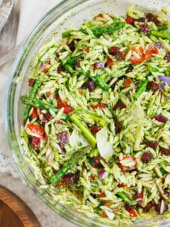 A great springtime pasta salad dish to bring to outdoor events or to have at home! The flavors and colors of this dish will make any day cheery!