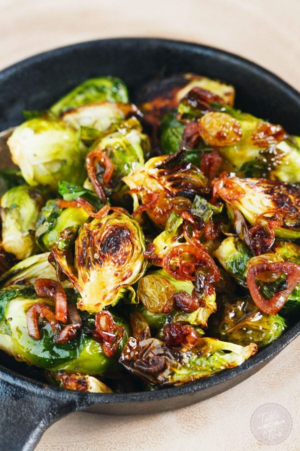 A new side dish for you to try! Roasted brussels sprouts tossed with caramelized shallots and golden raisins topped with salty cotija cheese. You will LOVE this new addition to your dinner table!