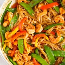 An easy and flavorful weeknight dish to satisfy your stir fry craving! This ginger garlic shrimp noodle stir fry is packed with everything your tastebuds will love and they'll love you back!