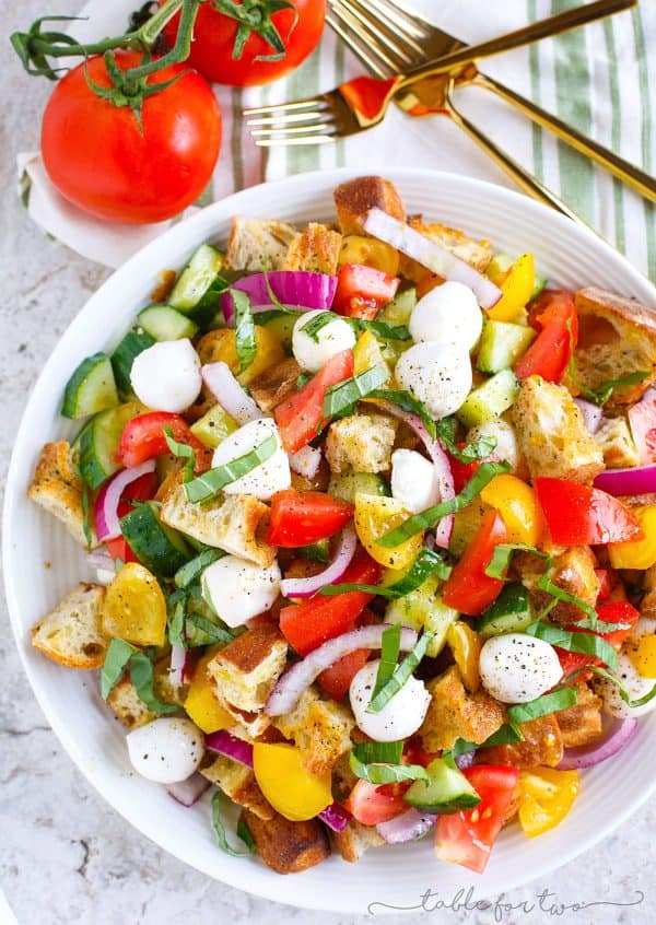 A delightfully light and refreshing summer panzanella salad for your dinner table! This is a great way to use up all the abundant summer produce and a great dinner side item or even as an entree!