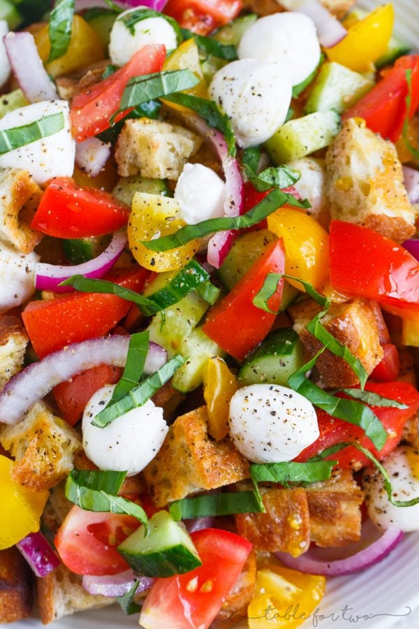 A delightfully light and refreshing summer panzanella salad for your dinner table! This is a great way to use up all the abundant summer produce and a great dinner side item or even as an entree!