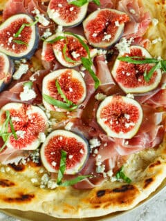 A classic combination of flavors but what better than to throw it on a grilled pizza? The pungent blue cheese pairs so well with the rest of the sweet figs and salty prosciutto!