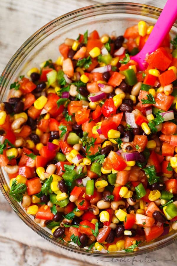 The most colorful salad you will have at your next party or barbecue! Cowboy caviar is like a mashup between salsa and beans. Salsa and beans had a baby and named it cowboy caviar because it's just so hearty and richly delicious!