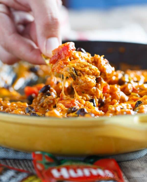 A cheesy dip for all your tailgating and game days! This cheesy chorizo chili dip is so easy to whip up and all your friends will be wanting the recipe! Made with ingredients you probably already have in your pantry; you will love how easy this is to prepare!