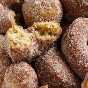 My idea of Fall is having a large plate of warm, fresh, homemade apple cider doughnuts with a cup of coffee in hand. This is the perfect cinnamon sugary treat full of apple cider flavor!