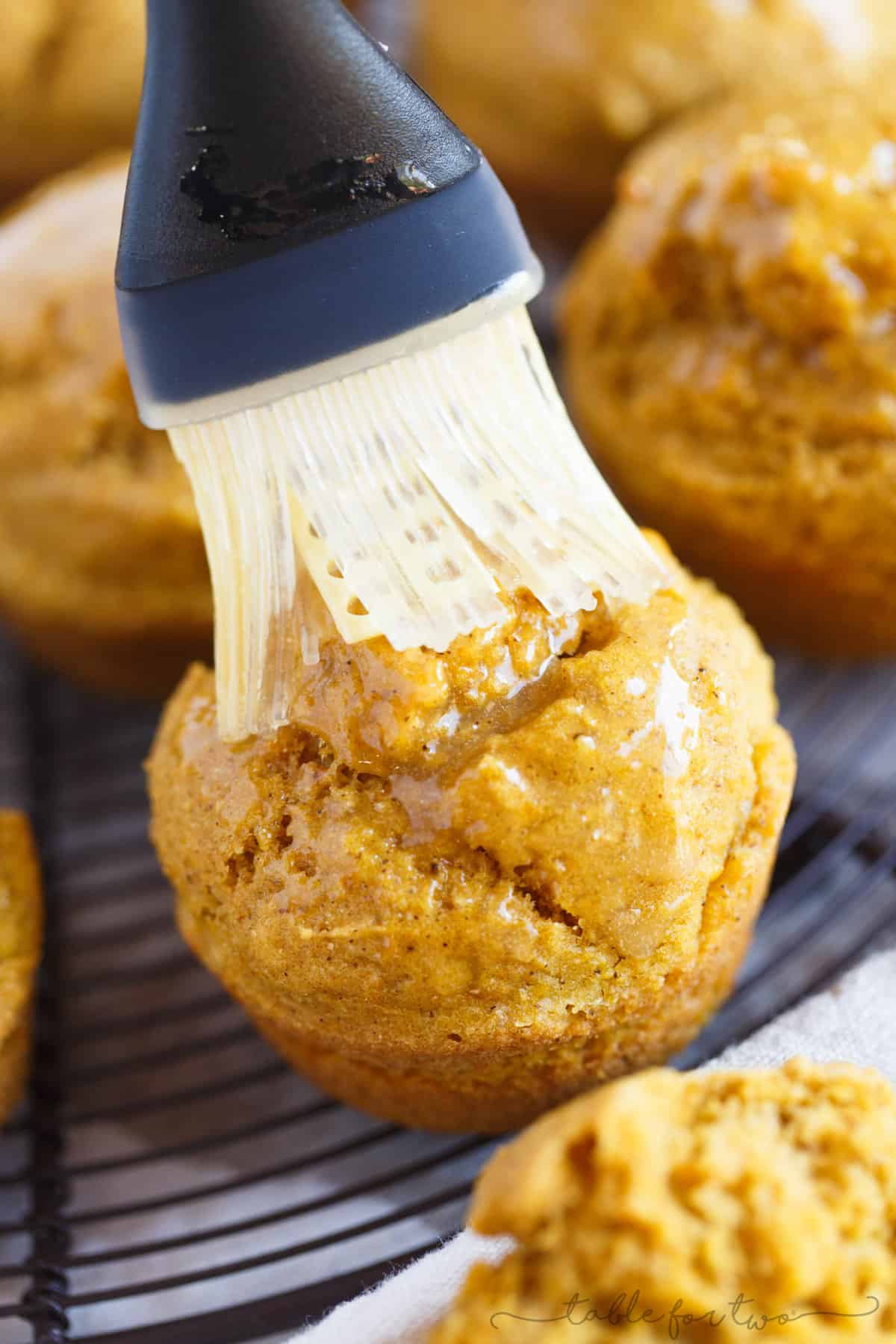 Pumpkin Cornbread Muffin being brushed with maple butter