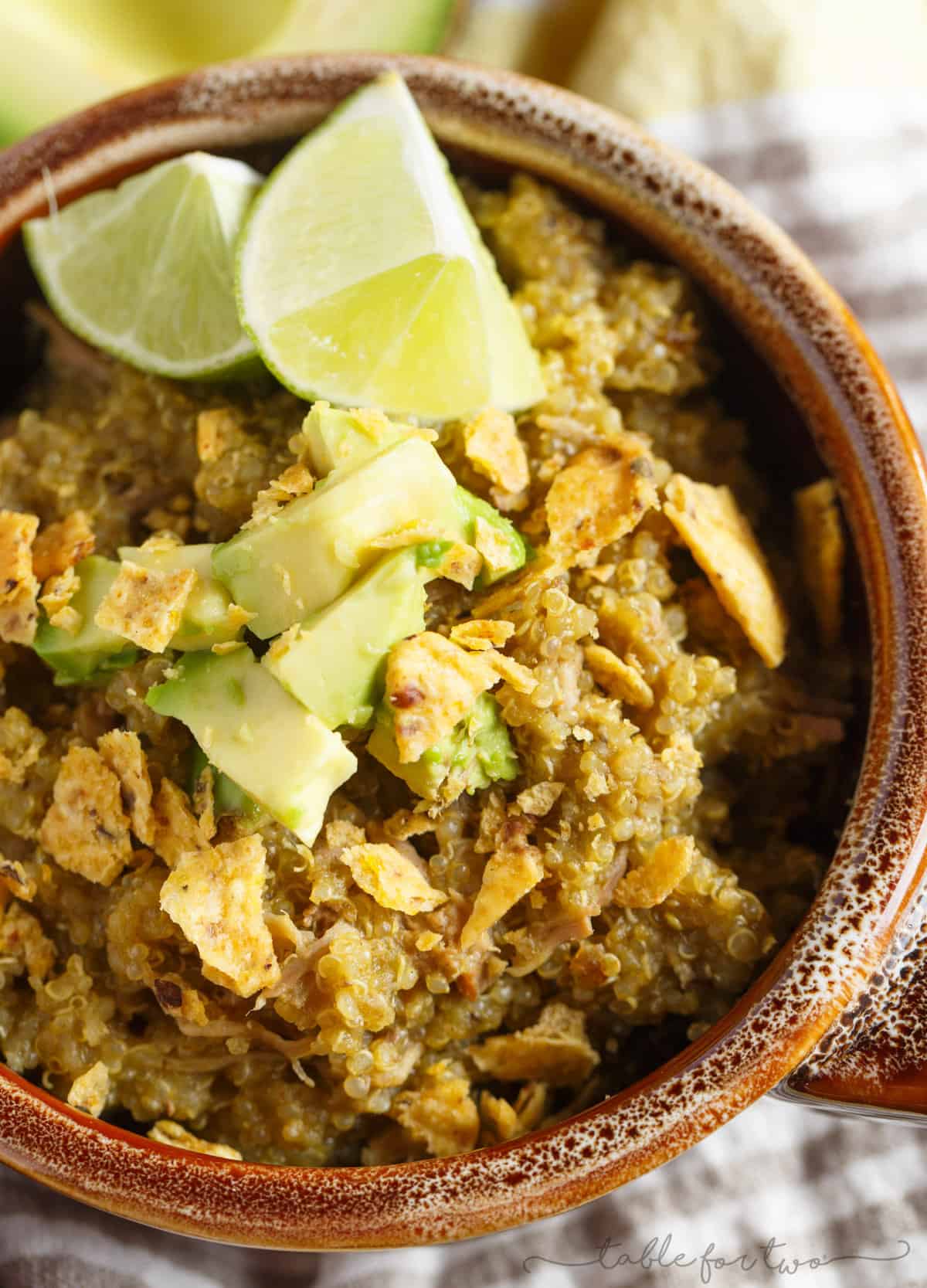 A low-effort weeknight meal with lots of flavor! Slow cooker poblano and tomatillo shredded pork and quinoa is a dish your family will love! The leftovers taste even better after the flavors meld even more! This can even be made in your pressure cooker!