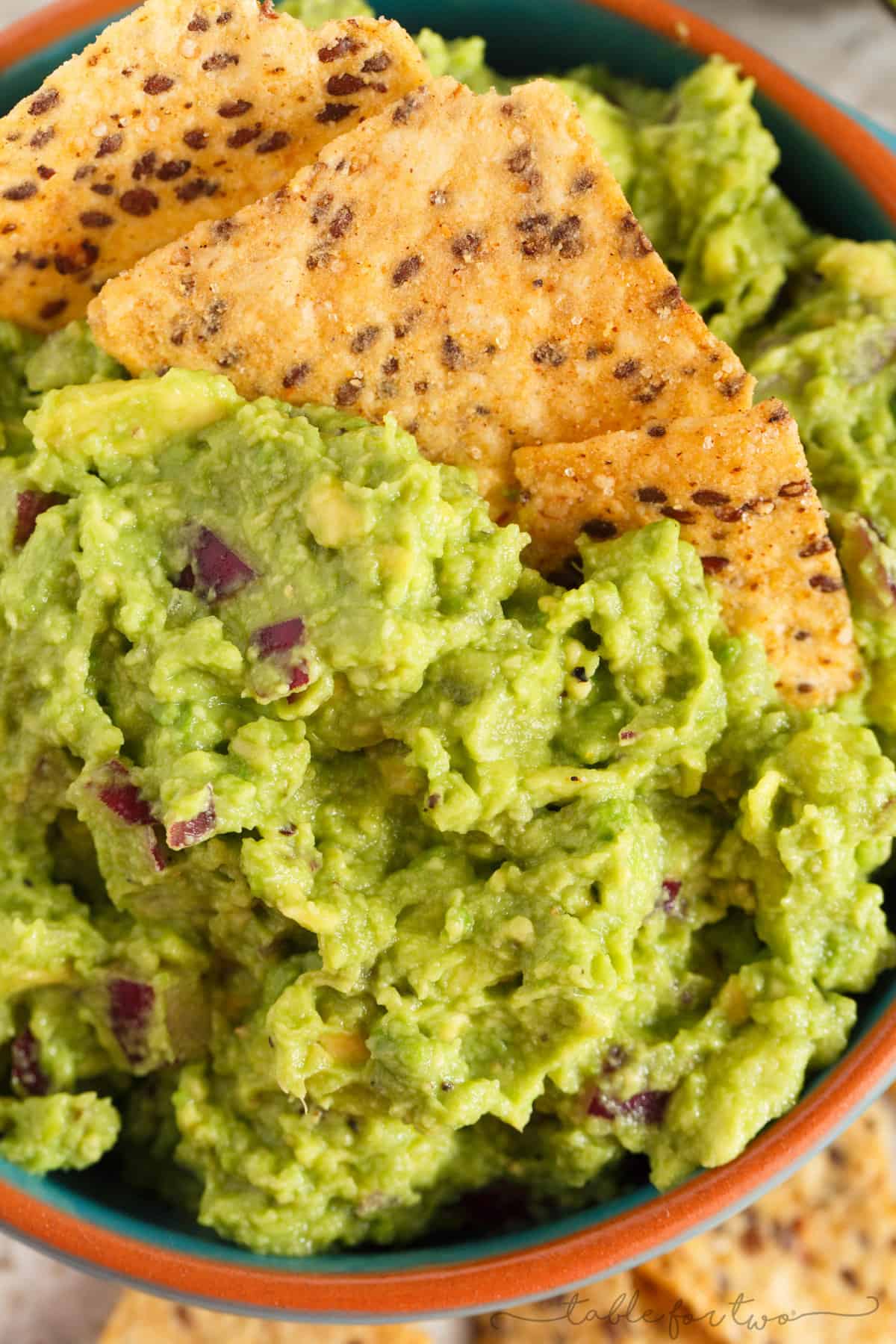 Everyone has to have a great guacamole recipe in their arsenal. Our favorite guacamole recipe is full of creaminess, tang, and bite! You will LOVE this version and always make batches of it to have on hand!