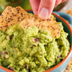 Everyone has to have a great guacamole recipe in their arsenal. Our favorite guacamole recipe is full of creaminess, tang, and bite! You will LOVE this version and always make batches of it to have on hand!