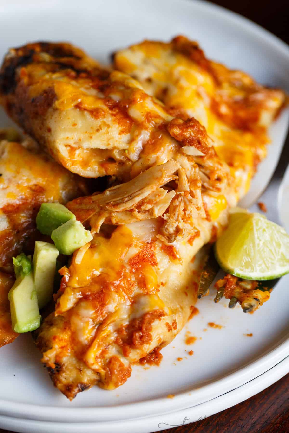 Homemade chicken enchiladas are a great comfort weeknight meal! Paired with a simple blender enchilada sauce, these will be a hit at the dinner table! #HuntsDifference #ad