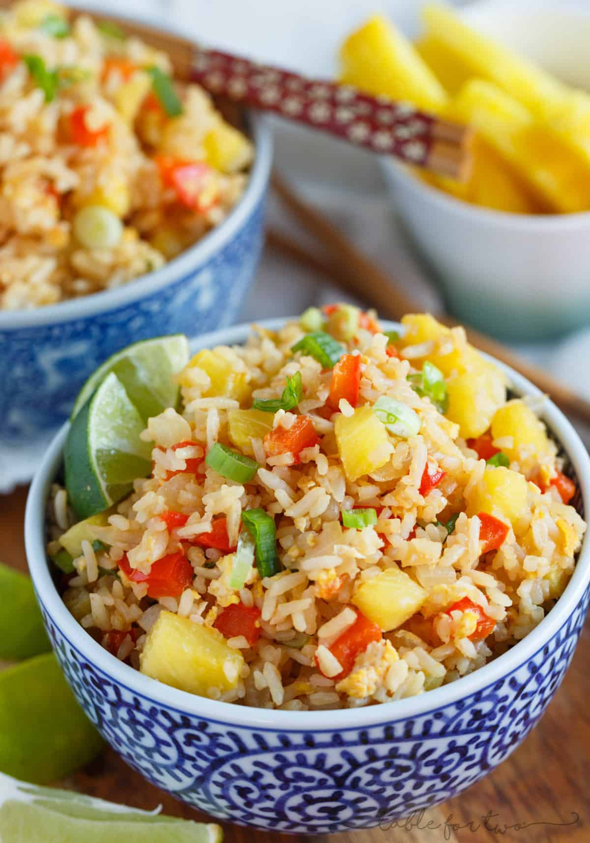 Take-out or take-in? You won't be able to tell that this pineapple fried rice was homemade and just as delicious as calling your neighborhood Thai takeout place! Much healthier to make this pineapple fried rice at home and it's super easy!