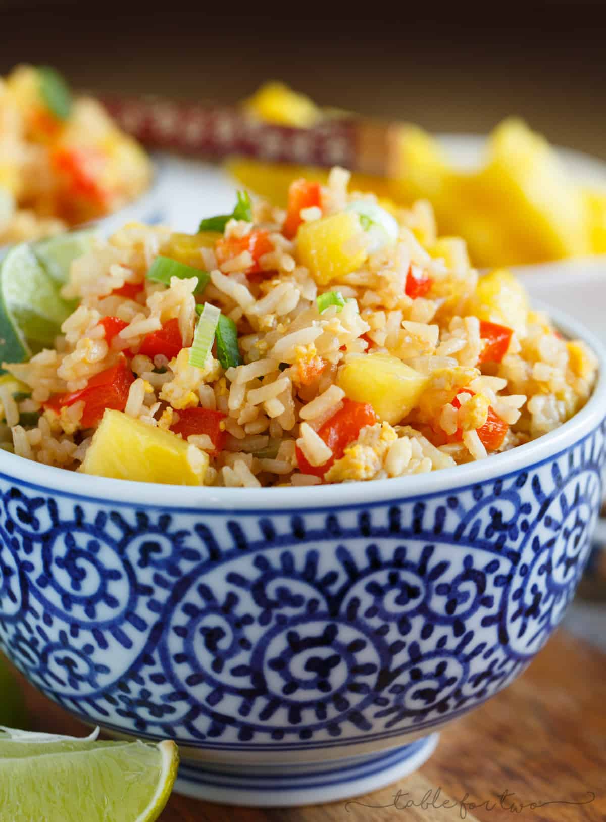 Take-out or take-in? You won't be able to tell that this pineapple fried rice was homemade and just as delicious as calling your neighborhood Thai takeout place! Much healthier to make this pineapple fried rice at home and it's super easy!