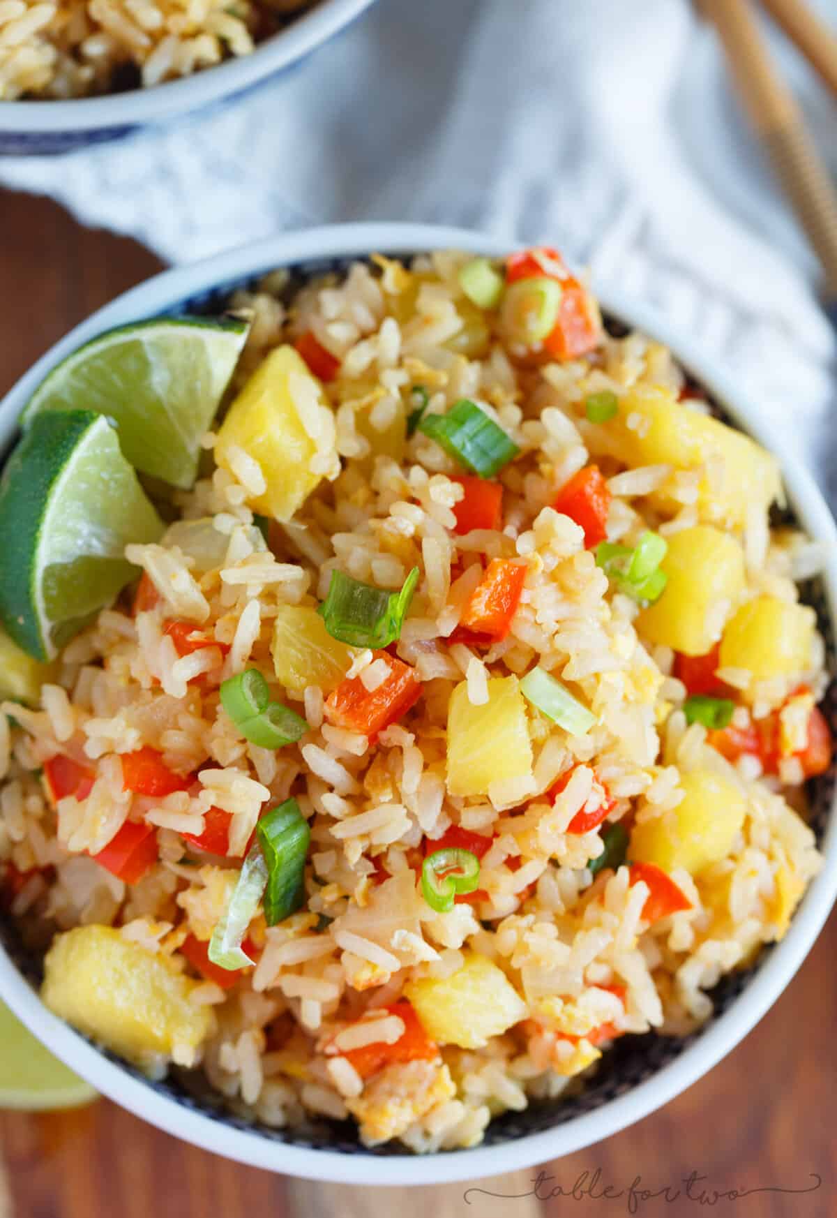 Take-out or take-in? You won't be able to tell that this pineapple fried rice was homemade and just as delicious as calling your neighborhood Thai takeout place! Much healthier to make this pineapple fried rice at home and it's super easy!