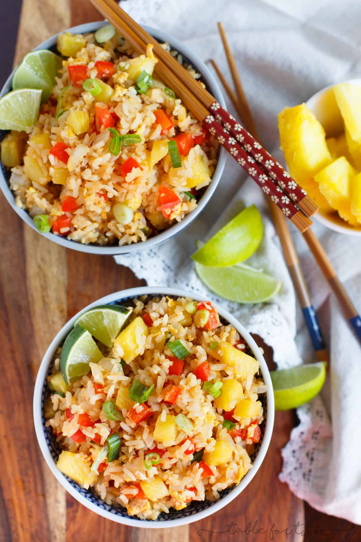 Take-out or take-in? You won't be able to tell that this pineapple fried rice was homemade and just as delicious as calling your neighborhood Thai takeout place! Much healthier to make this pineapple fried rice at home and it's super easy!