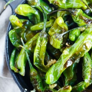 Blistered shishito peppers tossed in garlic and olive oil make for a great snack if you're feeling a little heat!