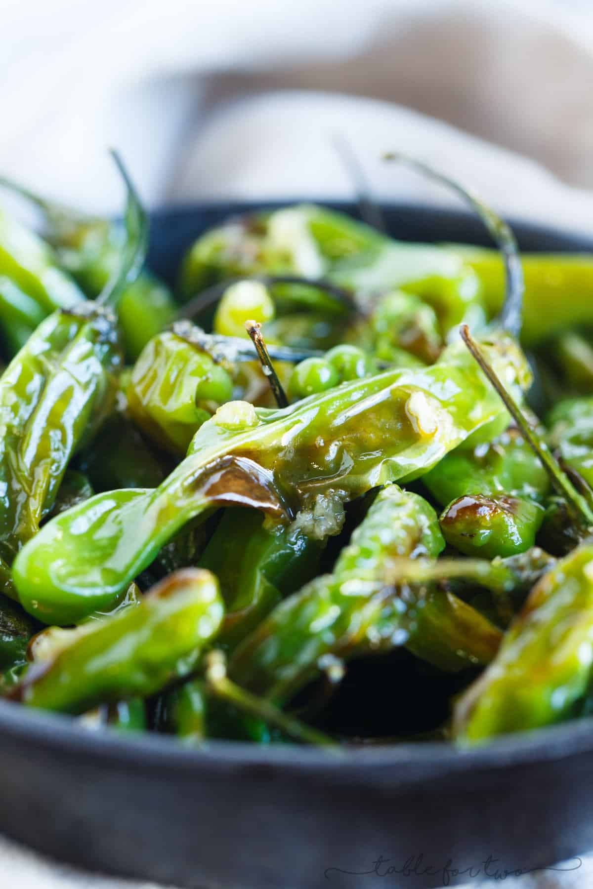 Blistered shishito peppers tossed in garlic and olive oil make for a great snack if you're feeling a little heat!