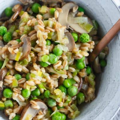 A great way to use farro in this flavorful dish! Filled with leeks, mushrooms, peas, and lots of parmesan cheese; this cozy farro dish is a quick one to whip up anytime of the week!