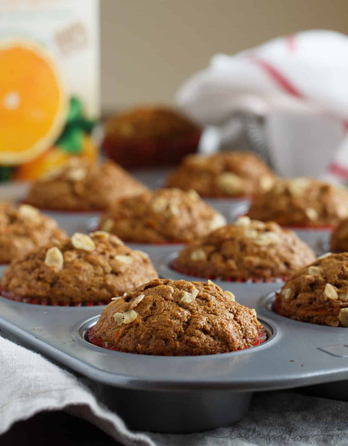 Incredibly flavorful, moist, and fluffy muffins for a quick on-the-go breakfast! Warm spices, orange and carrots make this spiced orange and carrot whole wheat muffin so tender and full of healthy goodness for your mornings!