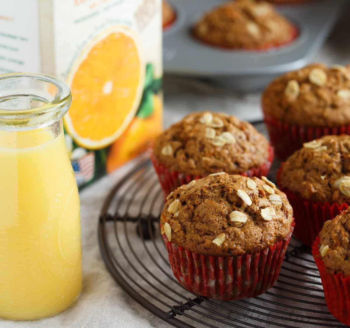 Incredibly flavorful, moist, and fluffy muffins for a quick on-the-go breakfast! Warm spices, orange and carrots make this spiced orange and carrot whole wheat muffin so tender and full of healthy goodness for your mornings!