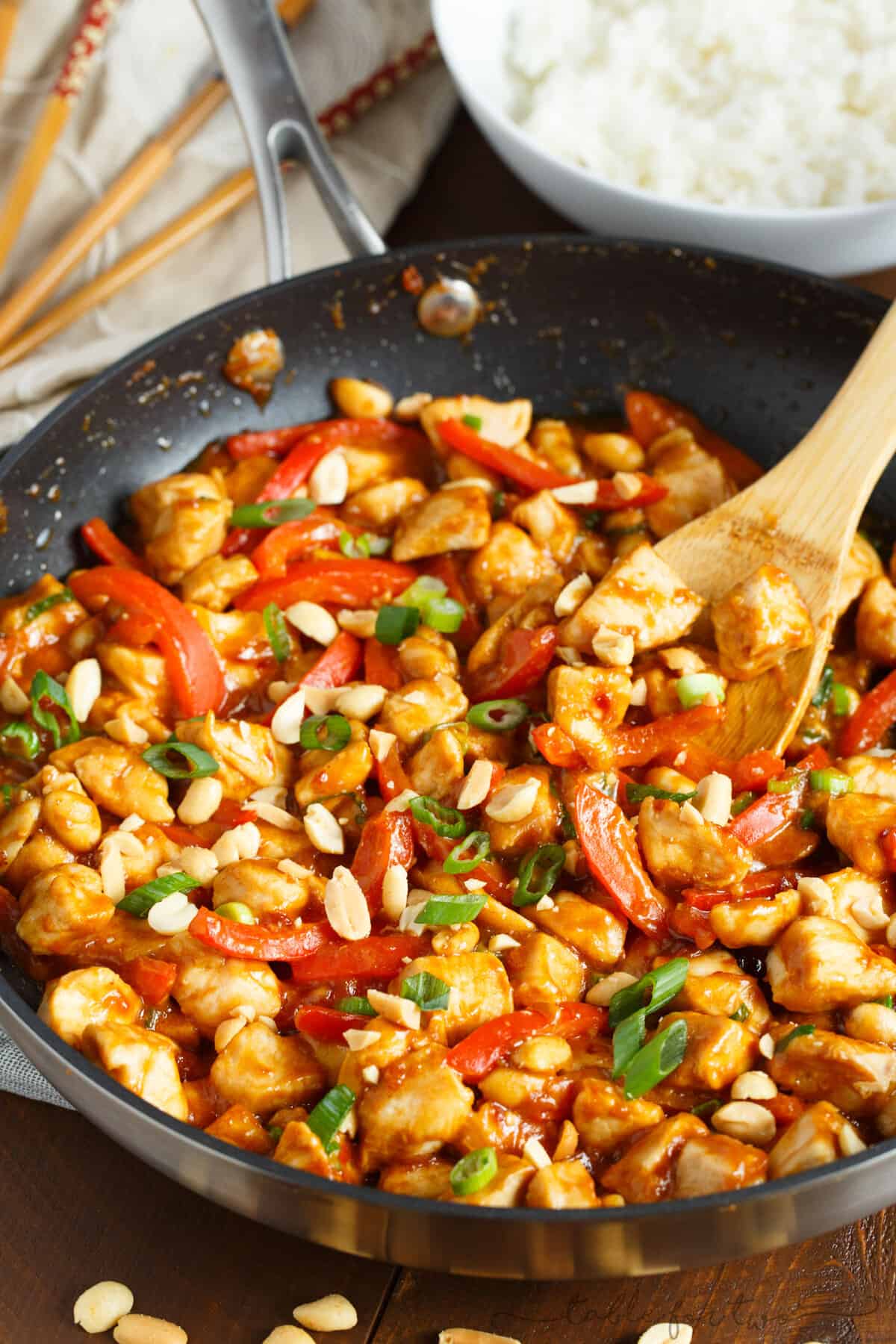 If you've never used peanut butter in a savory dish, this spicy peanut chicken is a dish you must try! It comes together in less than 30 minutes and it's so full of flavor! It will easily become a favorite dinner in no time!