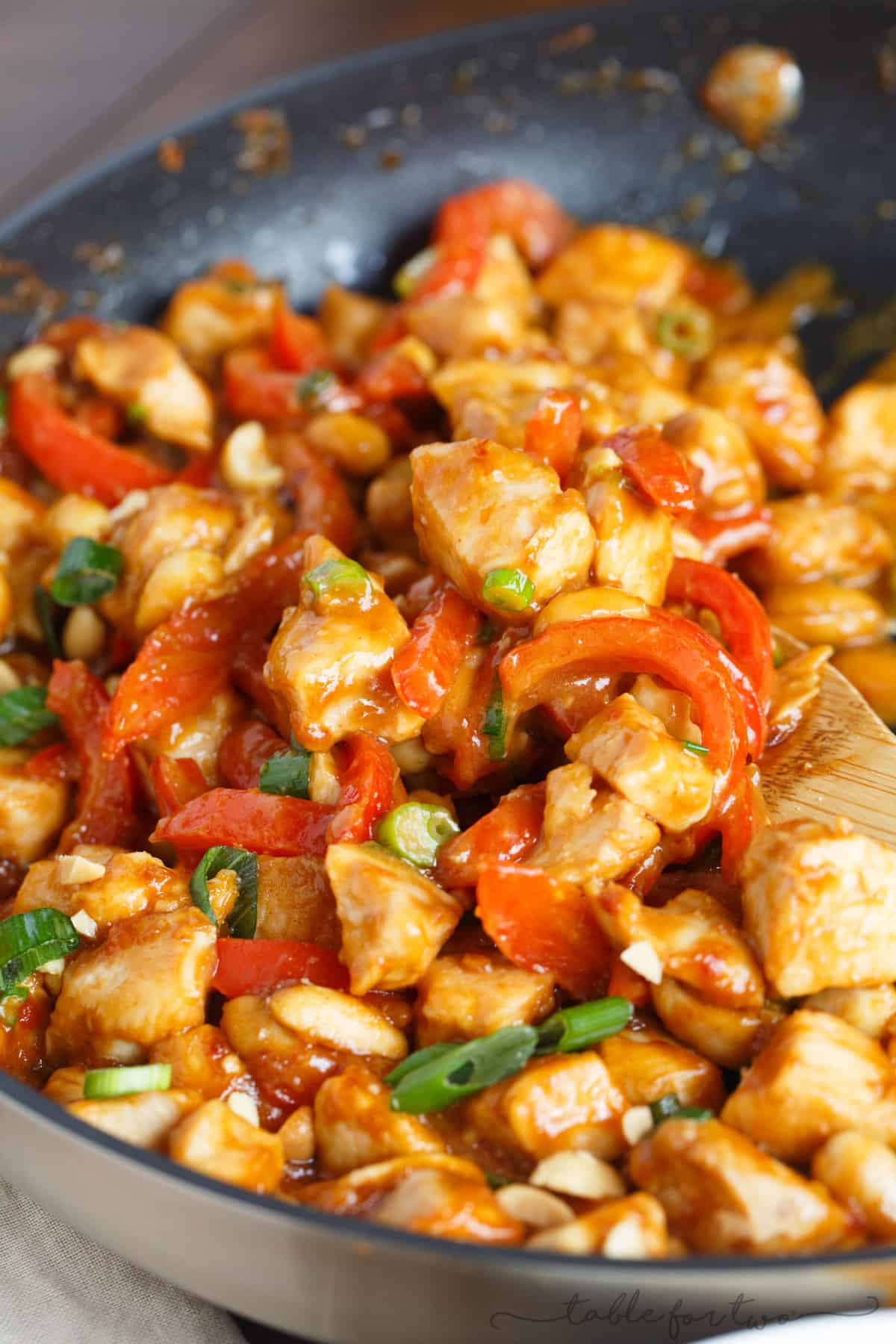 If you've never used peanut butter in a savory dish, this spicy peanut chicken is a dish you must try! It comes together in less than 30 minutes and it's so full of flavor! It will easily become a favorite dinner in no time!