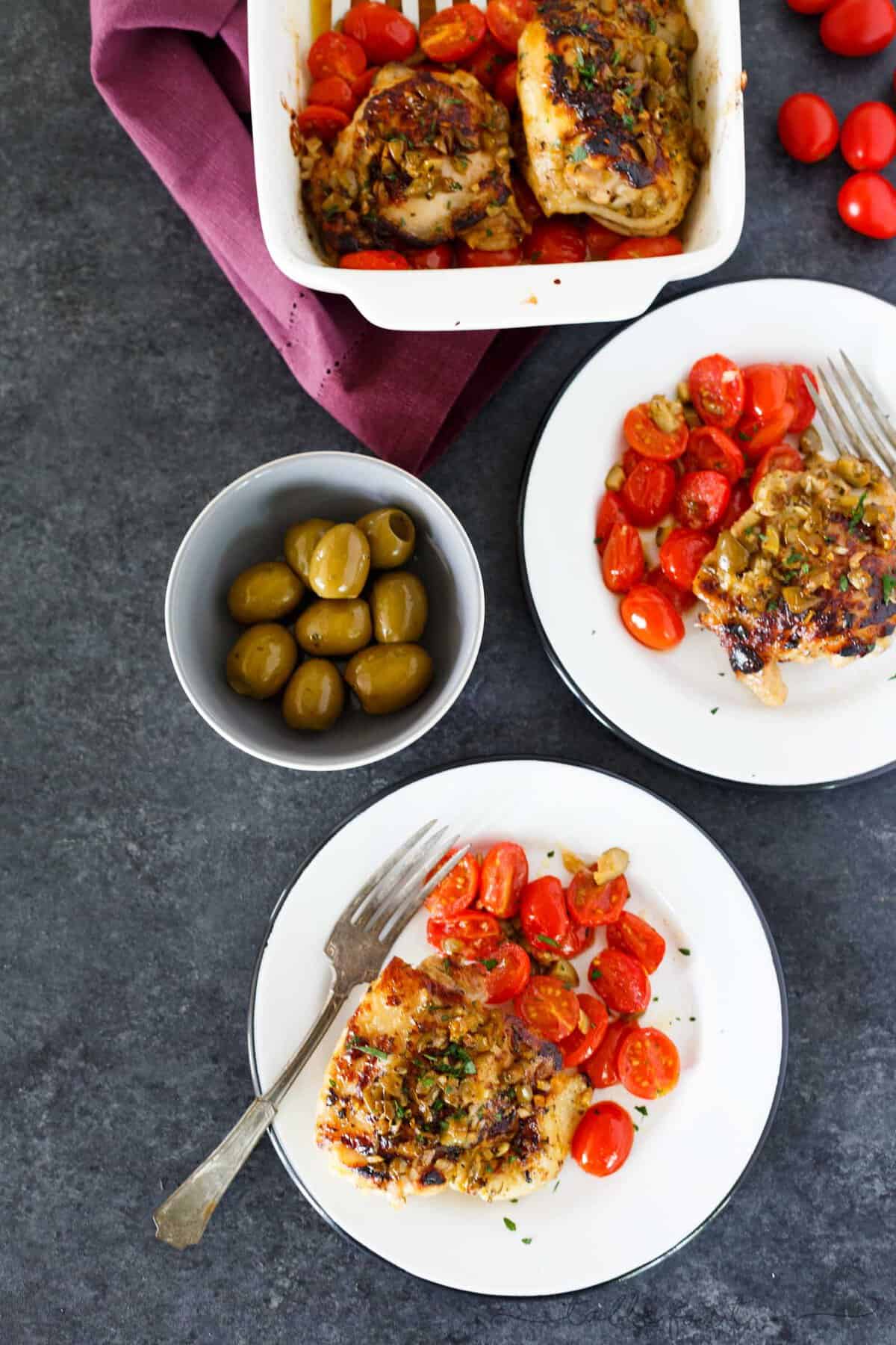 This oven-roasted chicken with olives and tomatoes is a deliciously flavorful weeknight dish. If you love briney and sweet; this roasted chicken is going to be your new favorite. The marinade is packed with flavor and is the perfect compliment to chicken!